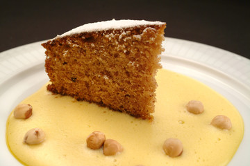 Wall Mural - Italian food recipe, traditional hazelnuts cake and eggnog sauce