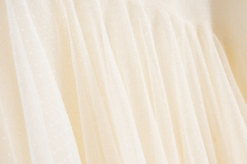 Wall Mural - Beautiful handmade white wedding dress. Material closeup background with bokeh.