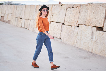 Young stylish girl walkig outdoors