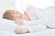 © Siriluk - On the bed in the white room.Beautiful woman sleeping in the bedroom.Asian girl sleep well.Sleeping in a white room makes you feel comfortable.Warm tone.