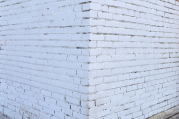  Brick wall painted with white paint.