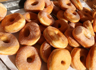 Wall Mural - many fried doughnut with sugar