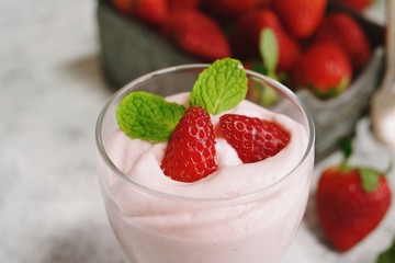 Poster - Homemade Strawberry Mousse topped with berries and mint leaf garnish, selective focus