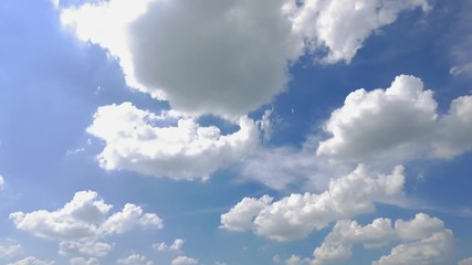 time lapse of little fluffy clouds disappearing in a blue, bright sunny sky.