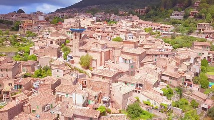 Wall Mural - Valldemossa aerial view of the city in mountains, Mallorca Spain. Sunny day in Valldemoss. Famous city in Majorca.