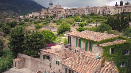 Wall Mural - Valldemossa aerial view of the city in mountains, Mallorca Spain. Sunny day in Valldemoss. Famous city in Majorca.