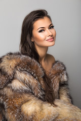 beautiful an young woman wearing winter natural coat