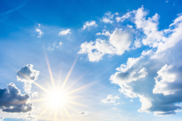 summer background, wonderful blue sky with bright sun and clouds
