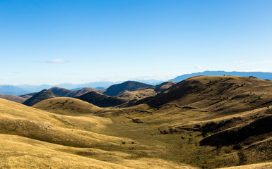 Panoramic view of beautiful landscape with Gran Sasso d'Italia peak at Campo Imperatore plateau in the Apennine Mountains, Abruzzo, Italy