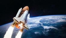 Space Shuttle Launch In Outer Space From Earth. Rocket On Orbit Of The Planet. Elements Of This Image Furnished By NASA