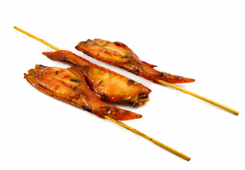 BBQ grilled chicken wings in bamboo stick thai style food isolated on white background