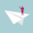 © fandijki - Businessman is speaking on a paper plane. Isolated on blue background.