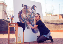 Young Woman Paint Artist Drawing At Home Roof. Picture Of Bulldog On Big Canvas. Outdoors Art