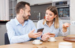 © JackF - Discontented couple with phones
