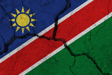 Wall Mural - Namibia flag on the cracked earth