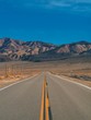 © KseniaJoyg - Empty picturesque desert road in the valley of Death, going to the beautiful mountains