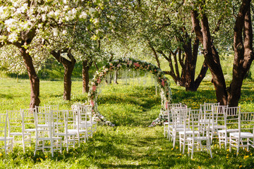 empty area for wedding registration in the spring garden. wedding ceremony for the bride and groom in the blooming garden