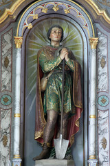 Saint Isidore, statue on the altar in the Saint Eliah church in Lipnik, Croatia