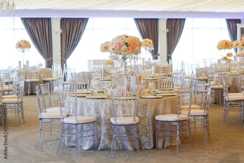 Tall White Rose Centerpieces At Indoor Wedding Reception Venue