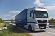 LKW transportiert Güter auf der Straße - Logistik und Spedition // Trucks transport goods by road - logistics and freight forwarding 