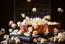 Salted Popcorn In A Wooden Bowl, Unhealthy Food, Dark Wooden Kitchen Table Background, Selective Focus
