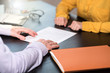 © thodonal - Business negotiation between businesswoman and businessman, light effect