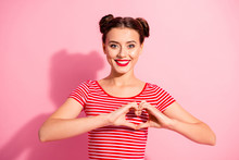 Close Up Photo Beautiful She Her Lady Pretty Two Buns Red Pomade Lips Hold Hands Arms Heart Shape Figure Symbolizing Cardiac Health Wear Casual Striped Red White T-shirt Isolated Pink Background