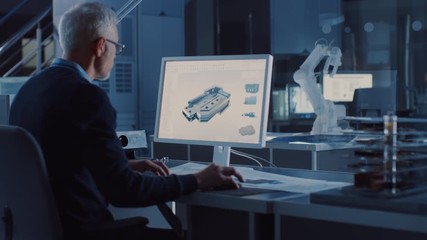 Leinwandbilder - Engineer Works on Computer Uses CAD Software to Design 3D Industrial Machinery Component. In the Background Robot Arm Concept Standing in Heavy Industry Engineering Facility. Over the Shoulder Shot