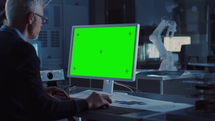 Aufkleber - Professional Heavy Industry Engineer Works on Green Mock-up Screen Computer. Engineering Bureau and Industrial Design Agency with Various Robotic, Architectural and Machinery Components