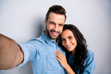 Wall Mural - Close up portrait two amazing she her he him his couple lady guy couple make take selfies wife husband valentine day wear casual jeans denim shirts outfit clothes isolated light grey background