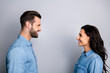 Lets talk. Profile side photo of cute positive beautiful students fellows staring speaking telling greeting having dialogue dressed in denim clothing isolated on argent background 