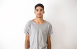 © Oleksandr - Portrait of a pretty African American boy. Black young teen man on a white background.