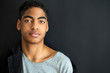 © Oleksandr - Fashion portrait of a beautiful boy on a black background. Portrait of a young African American man. Attractive teenager.