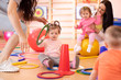 © Oksana Kuzmina - Nursery babies group doing sport in fitness club