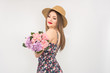 © Desmi - blonde in a straw hat and dress with a bouquet of flowers