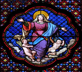 Assumption of Virgin Mary, stained glass window in the Basilica of Saint Clotilde in Paris, France 