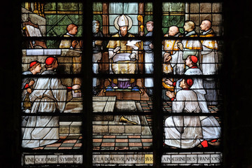 A dove, symbol of peace, appears on the chest of St Francis de Sales, stained glass windows in the Saint Laurent Church, Paris, France 