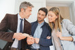 © goodluz - Real estate agent showing couple colour chart in contemporary home