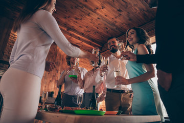 Low below angle view company of nice charming attractive pretty elegant cheerful positive ladies gentlemen having fun annual event tradition birthday celebratory in wood industrial loft interior room