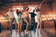 © deagreez - Full length body size view of nice company pretty charming attractive cheerful glad positive guys ladies having fun disco flying decorative elements rejoicing in industrial loft interior house