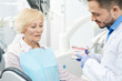 © Nestor - Professional dentist and his senior patient