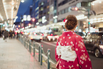 Wall Mural - Woman wearing traditional kimono on a street in Japan