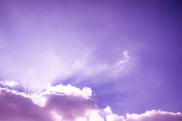 Sticker - Rays of light shining up. Beam of light and the fluffy clouds. Pink purple sky with sun rays