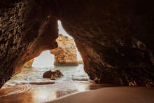 Scenic View Of Natural Arch In Sea Seen Through Cave