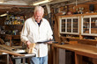 © Cavan Images - Carpenter using tablet computer in workshop