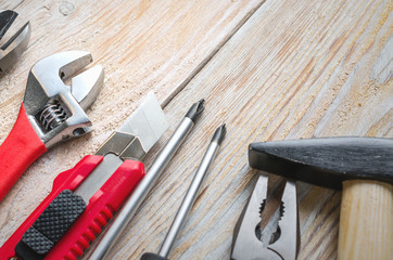 Carpenter working tools set on old vintage wooden background. Tools and workbench from the workshop.