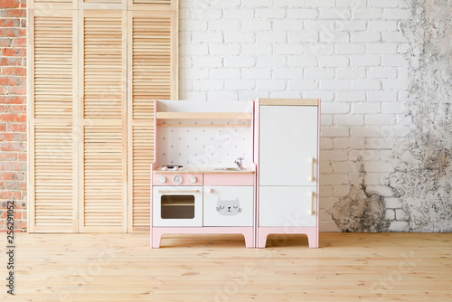 pink and white play kitchen