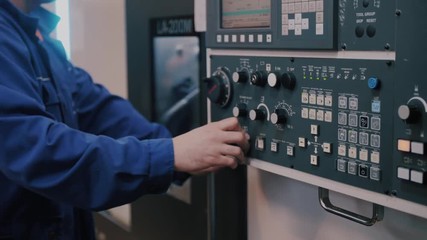 Macro control unit CNC machines and workers finger sets the program command