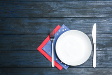 Patriotic Table Setting With Traditional USA Colors On Wooden Background, Flat Lay. Space For Text