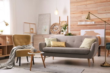 Poster - Stylish living room interior with comfortable sofa. Idea for home decor